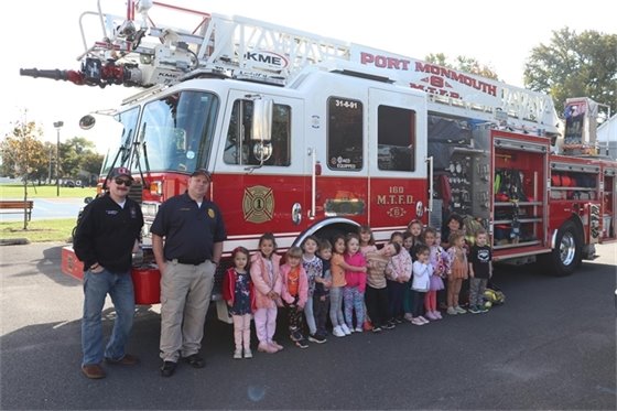Group photo of firefighters and students