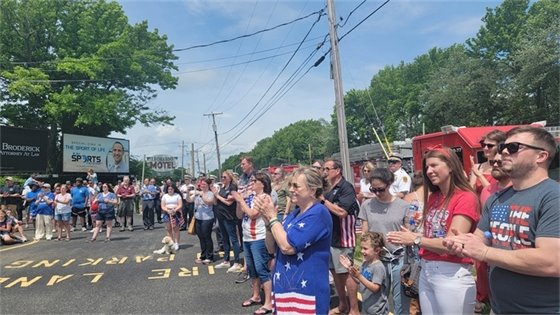 Community members clapping at American Legion Post 338