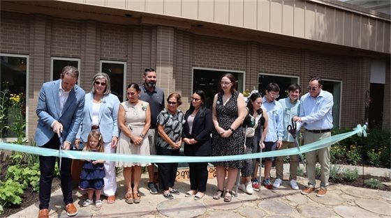 Group photo ribbon cutting