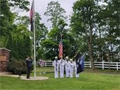 Lowering flag to half staff at Memorial Day Service