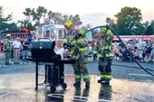 Volunteer firefighters putting out grill fire
