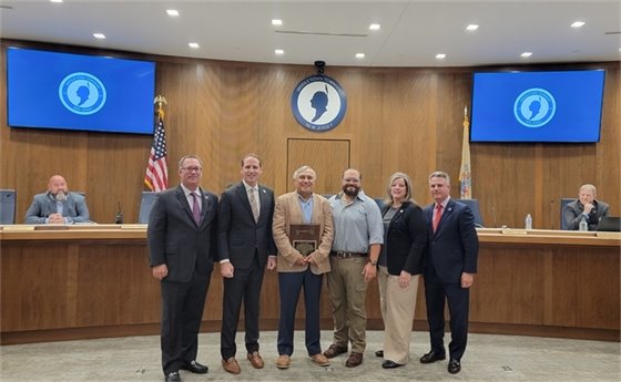 Group photo of George Kolber, his son Rick, and the Township Committee