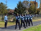 MTPD Honor Guard fires their rifles.