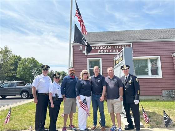 Group photo of elected officials and police officers