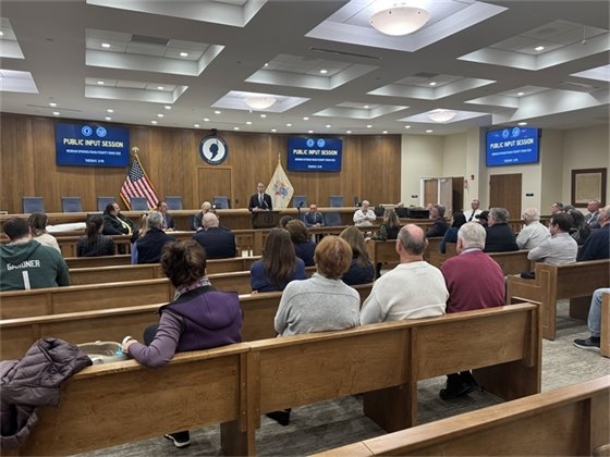 Mayor Perry outlines the project phases for community members.