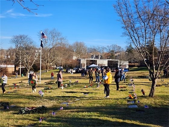 Photo of volunteers placing wreaths