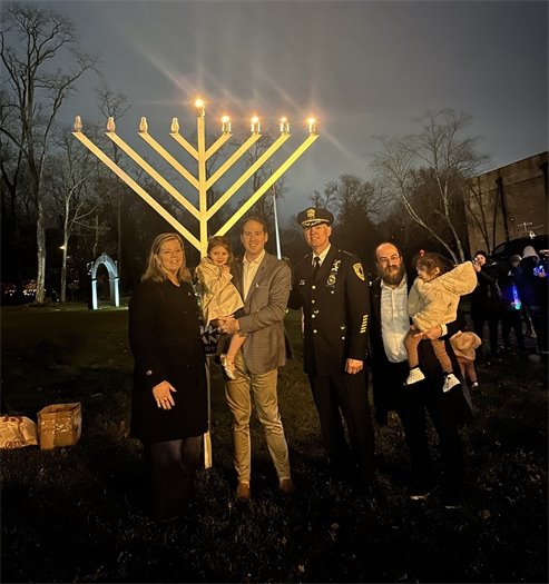 Group photo in front of Township menorah
