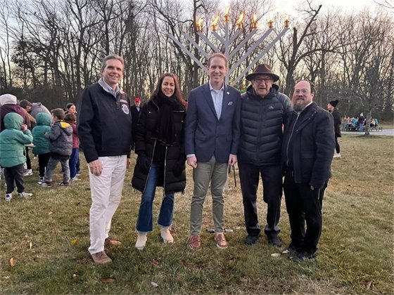 Group photo in front of menorah