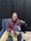 DFC Anthony Dellatacoma with his new cap in our podcast studio