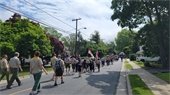 Community members marching the parade