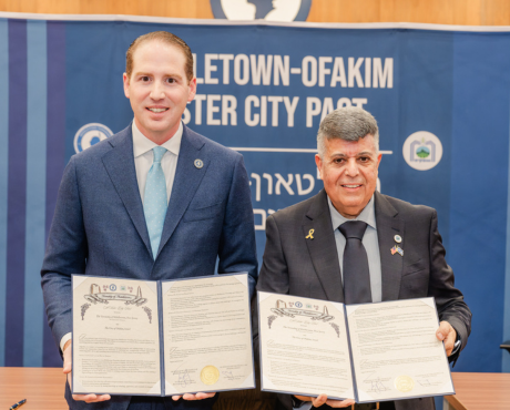 Mayor Tony Perry and Mayor Itzik Danino proudly display their signed sister city pact.